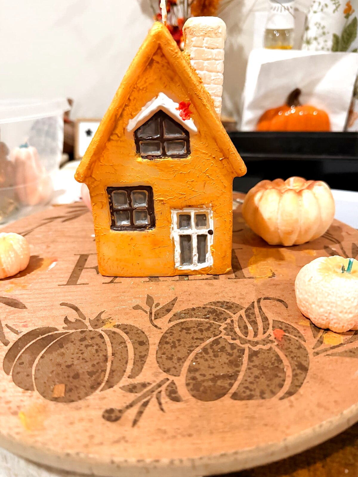 Close-up of a hand-painted candle cottage