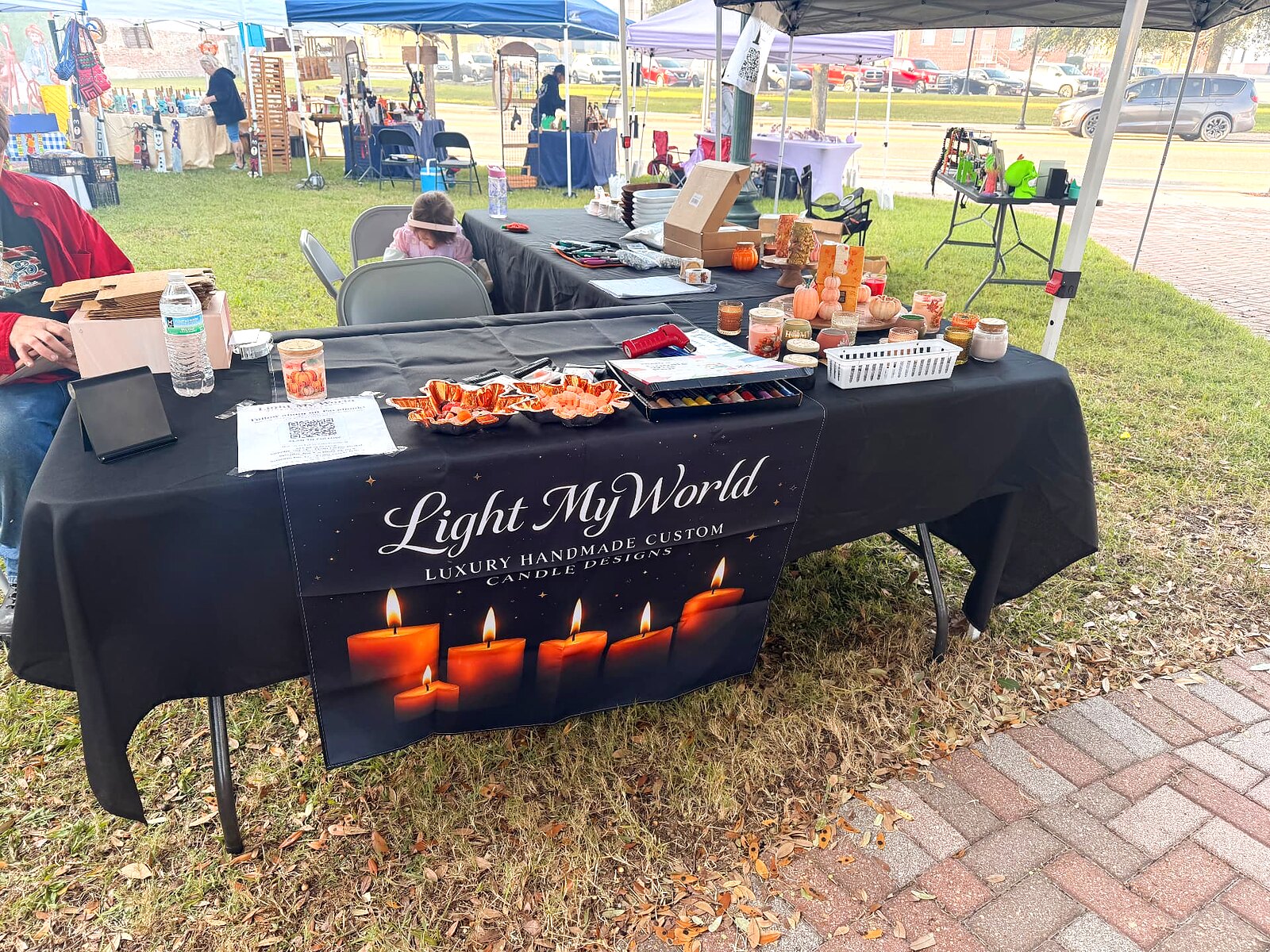 The Light My World table at a market