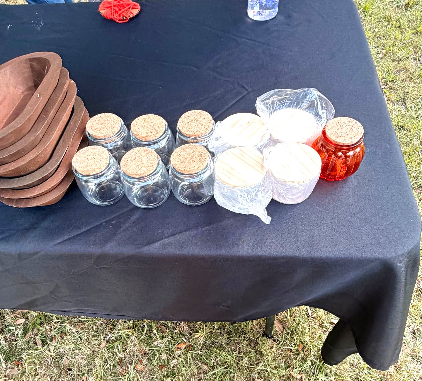 Empty jars with cork and wood lids waiting to be filled with pearl wax